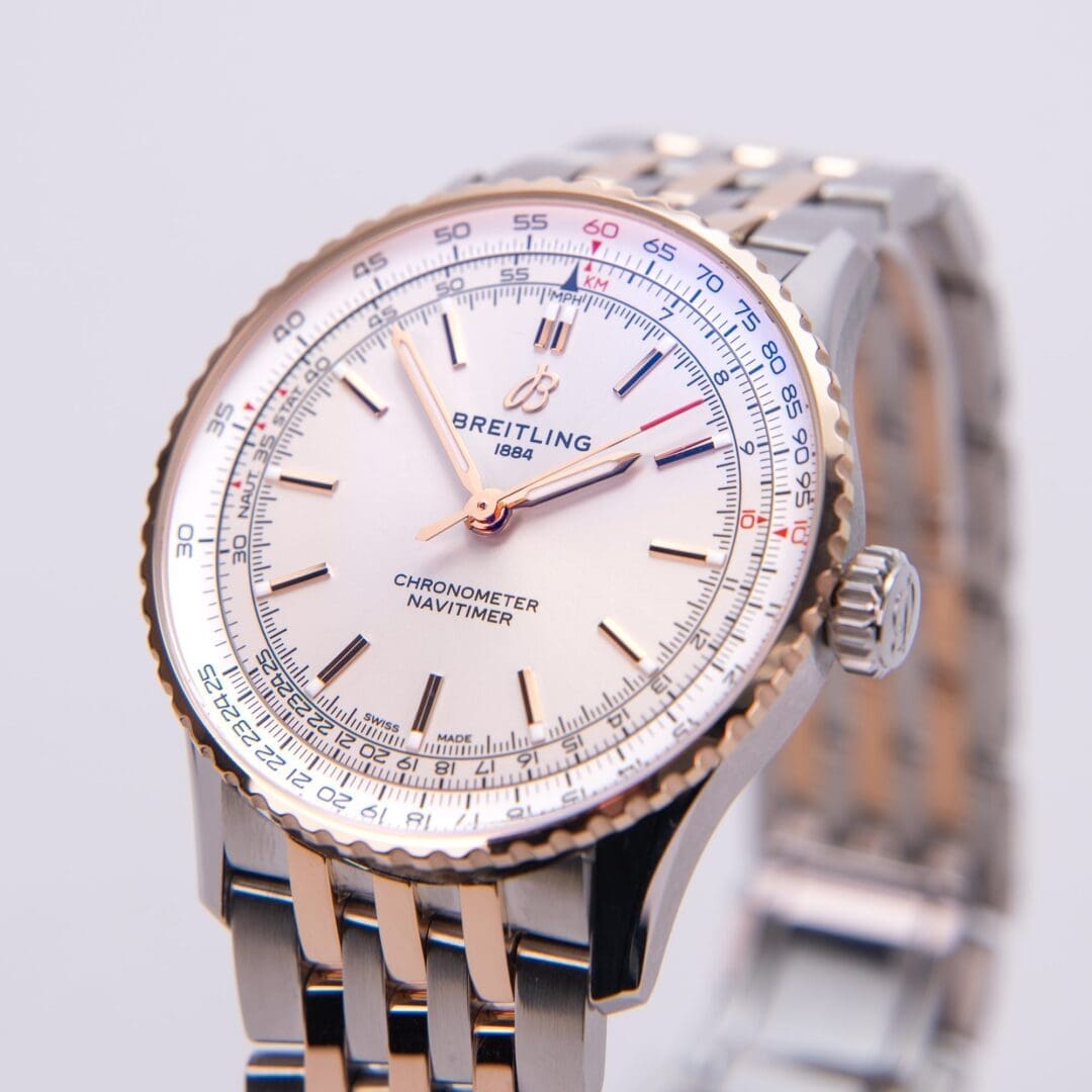 Luxury Breitling Navitimer watch with metal strap.