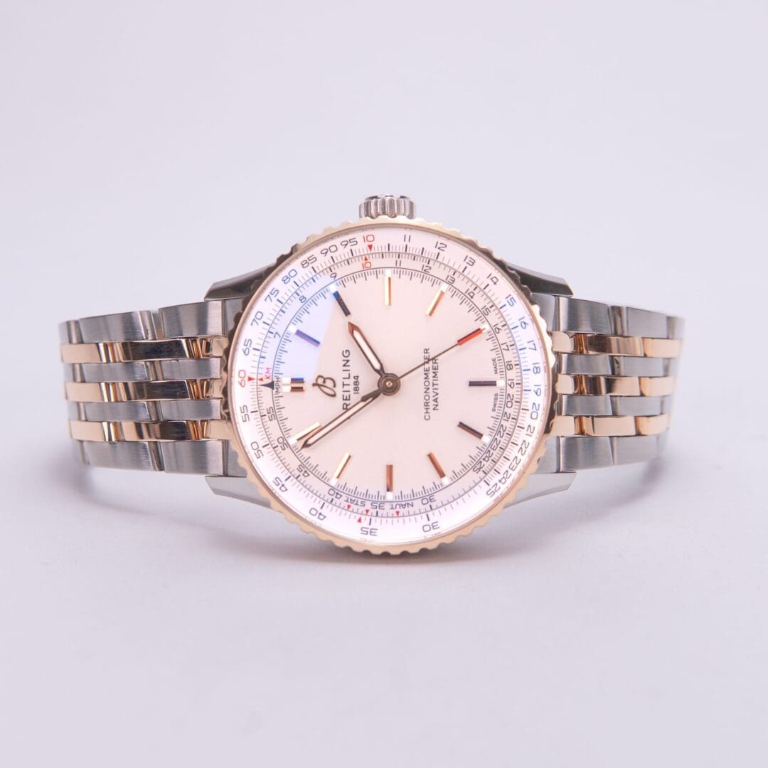 Luxury wristwatch with metal bracelet.