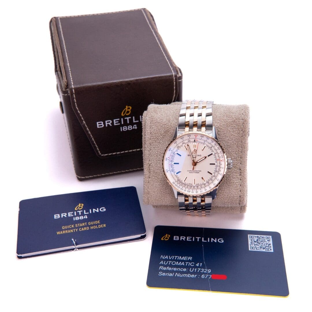 Breitling watch with box and warranty cards.