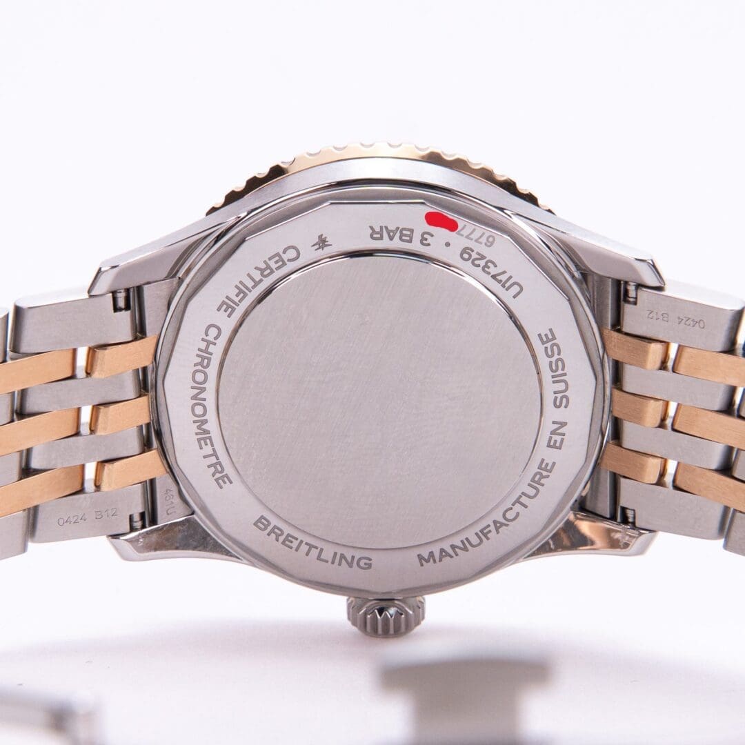 Back of a Breitling watch with bracelet.