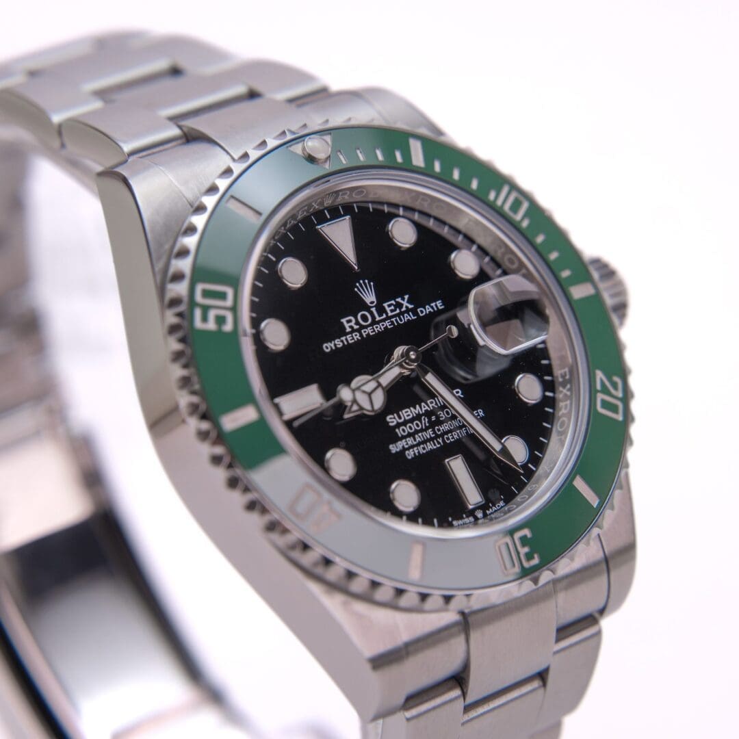 Luxury watch with green bezel and band.