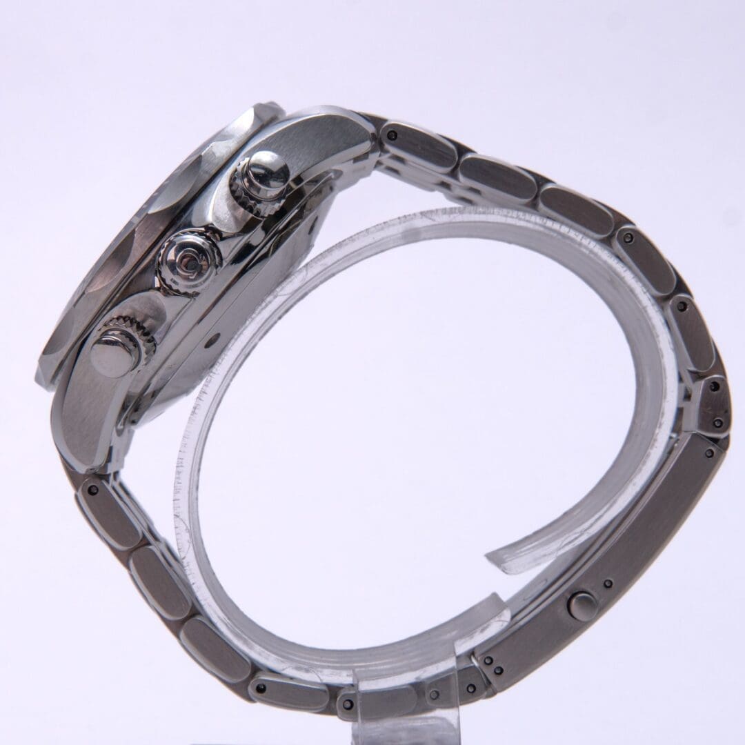 Side view of a silver wristwatch.