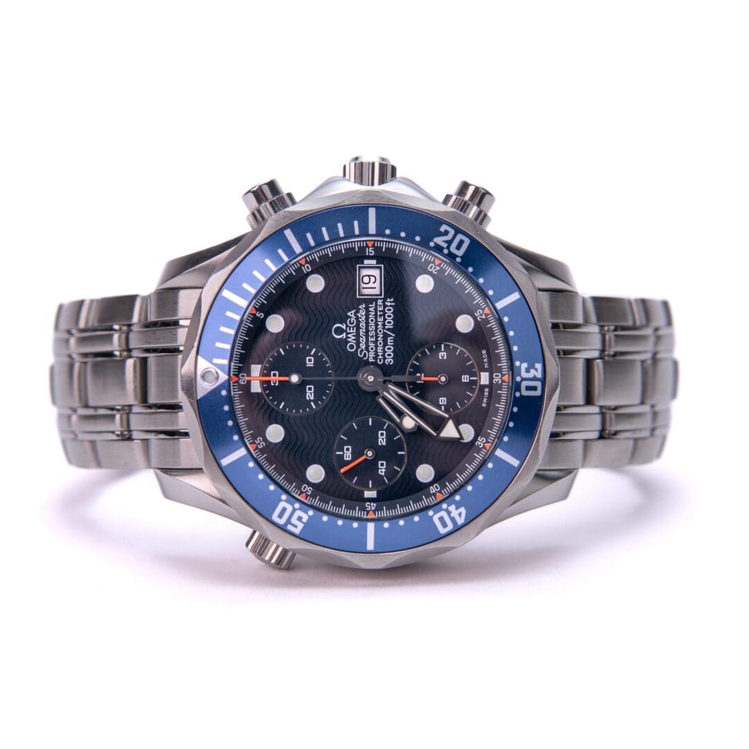 Blue and silver luxury wristwatch with bracelet.