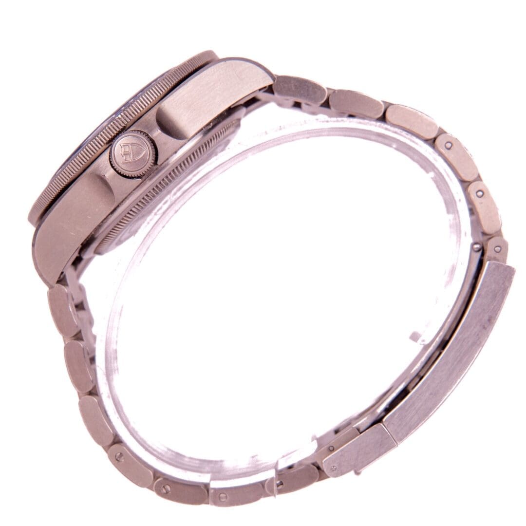 Metal wristwatch with a side view.