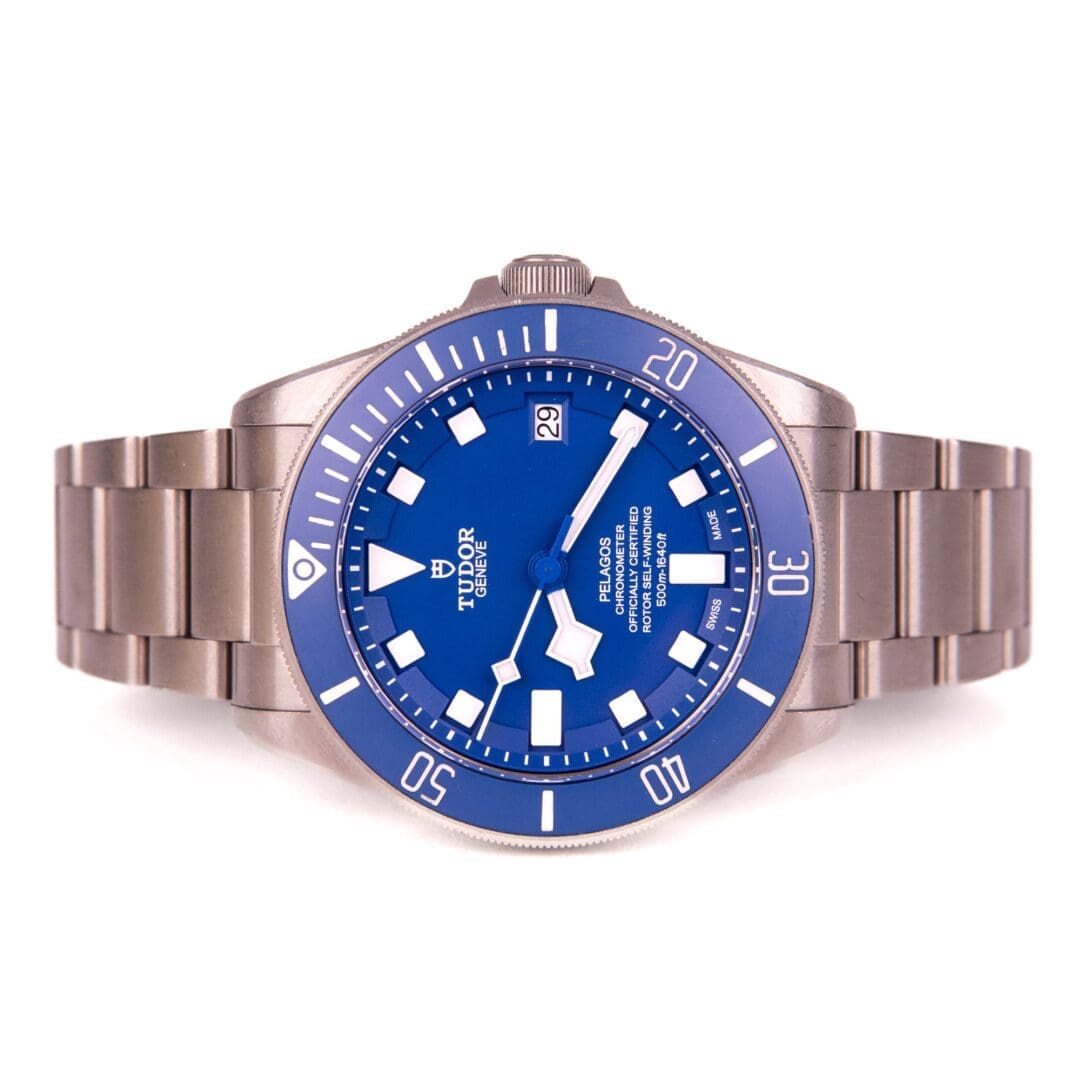 Stainless steel watch with blue dial.