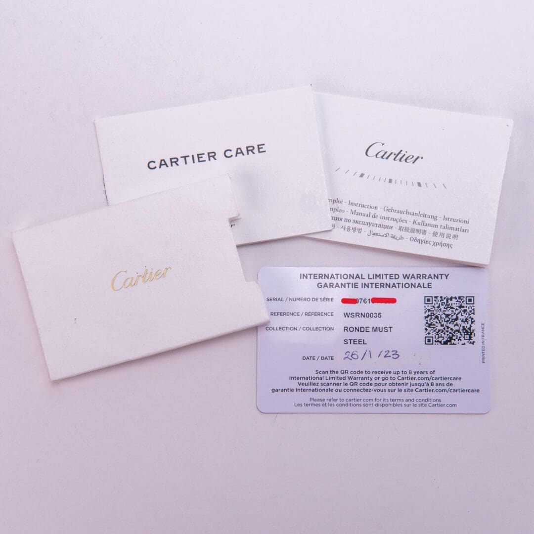 Cartier warranty cards and care booklet.