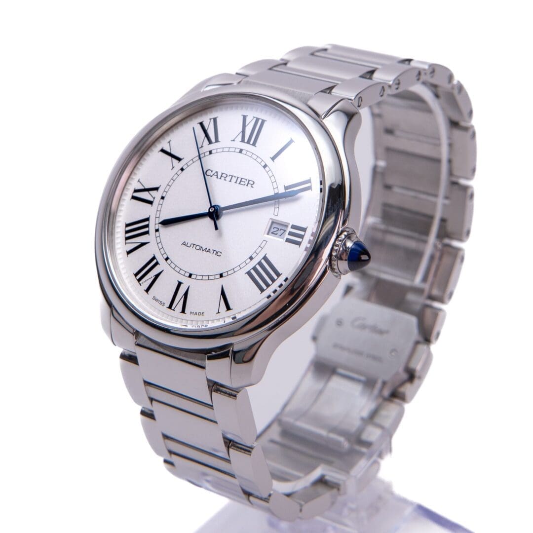 Silver Cartier watch with Roman numeral dial.