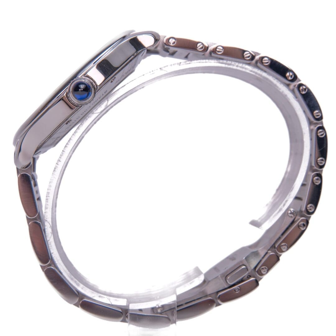 Silver wristwatch with blue crown detail.
