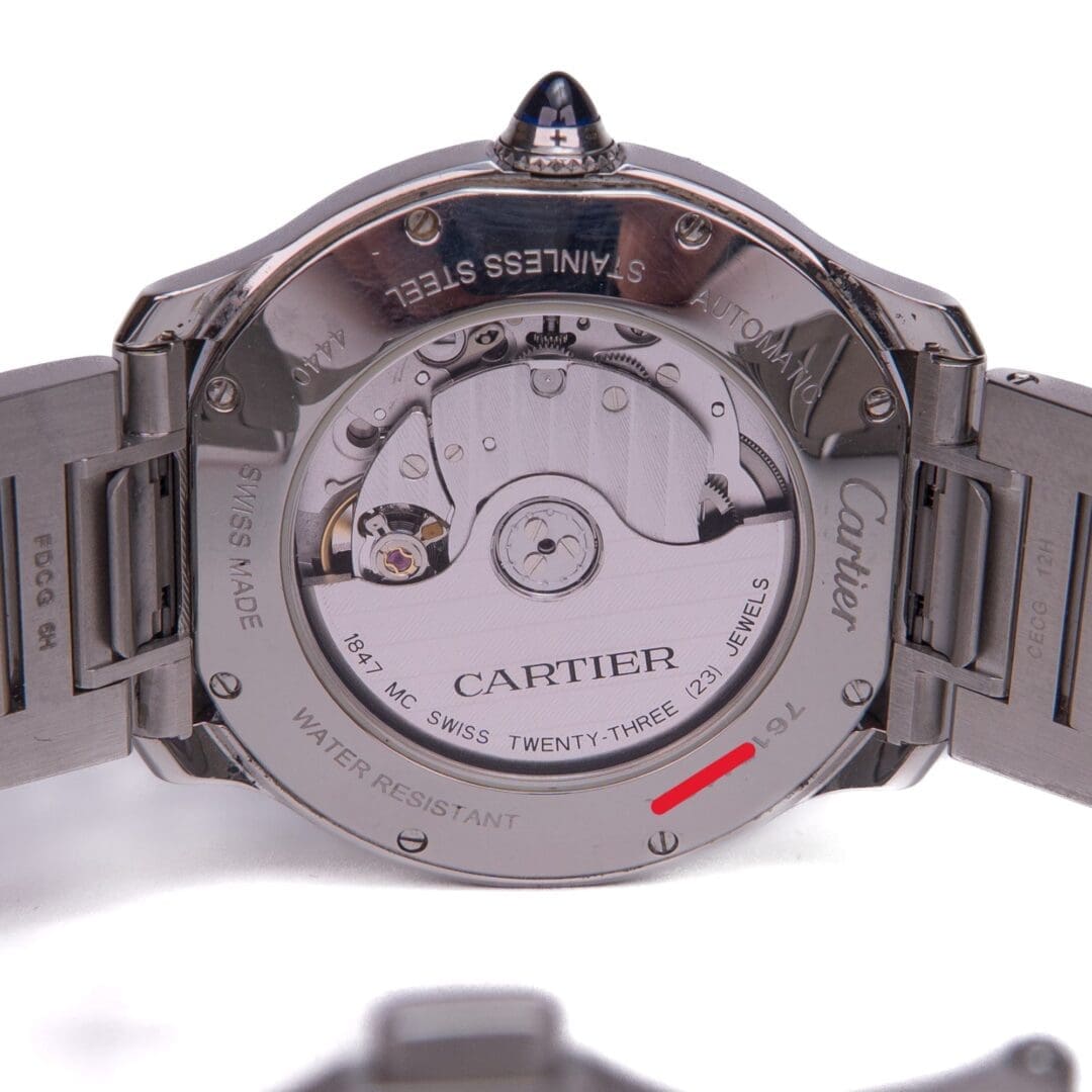 Cartier watch back showing internal mechanism.