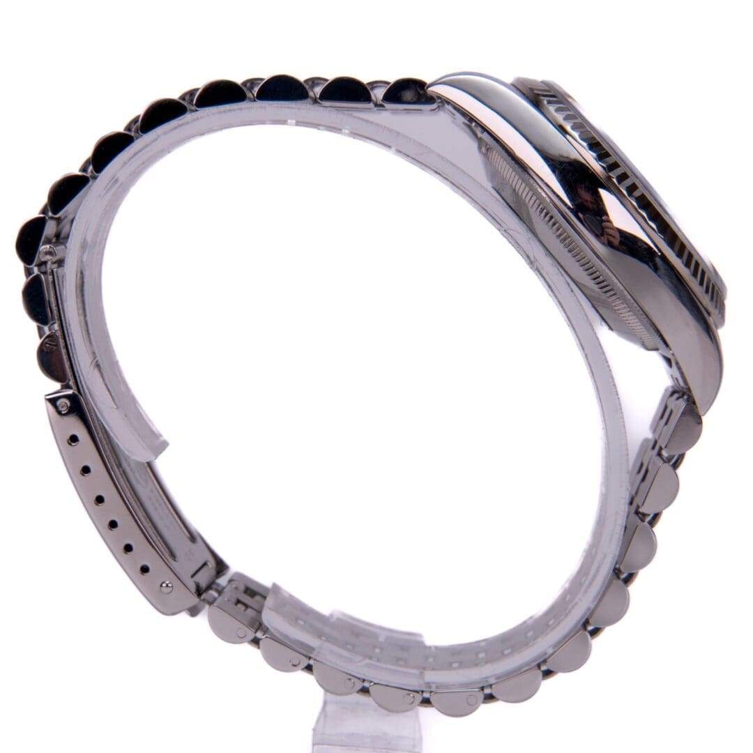 Side view of a silver wristwatch.