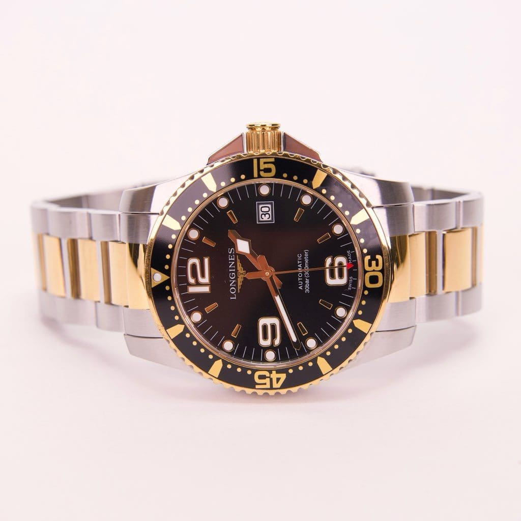 Two-tone stainless steel and gold wristwatch.