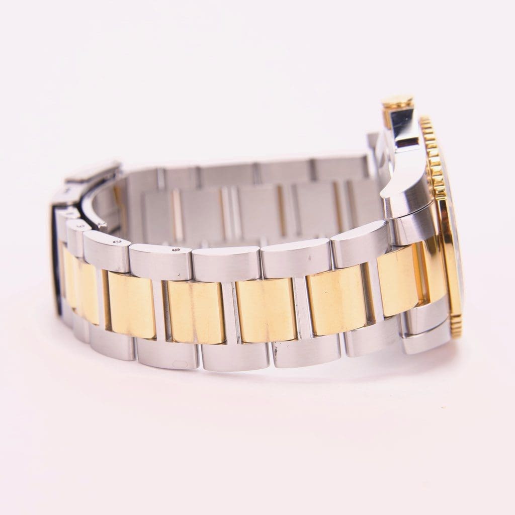 Two-tone metal watch bracelet side view.