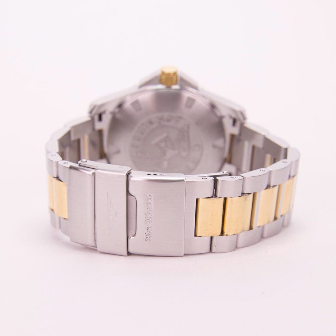 Two-tone metal watch bracelet and clasp.