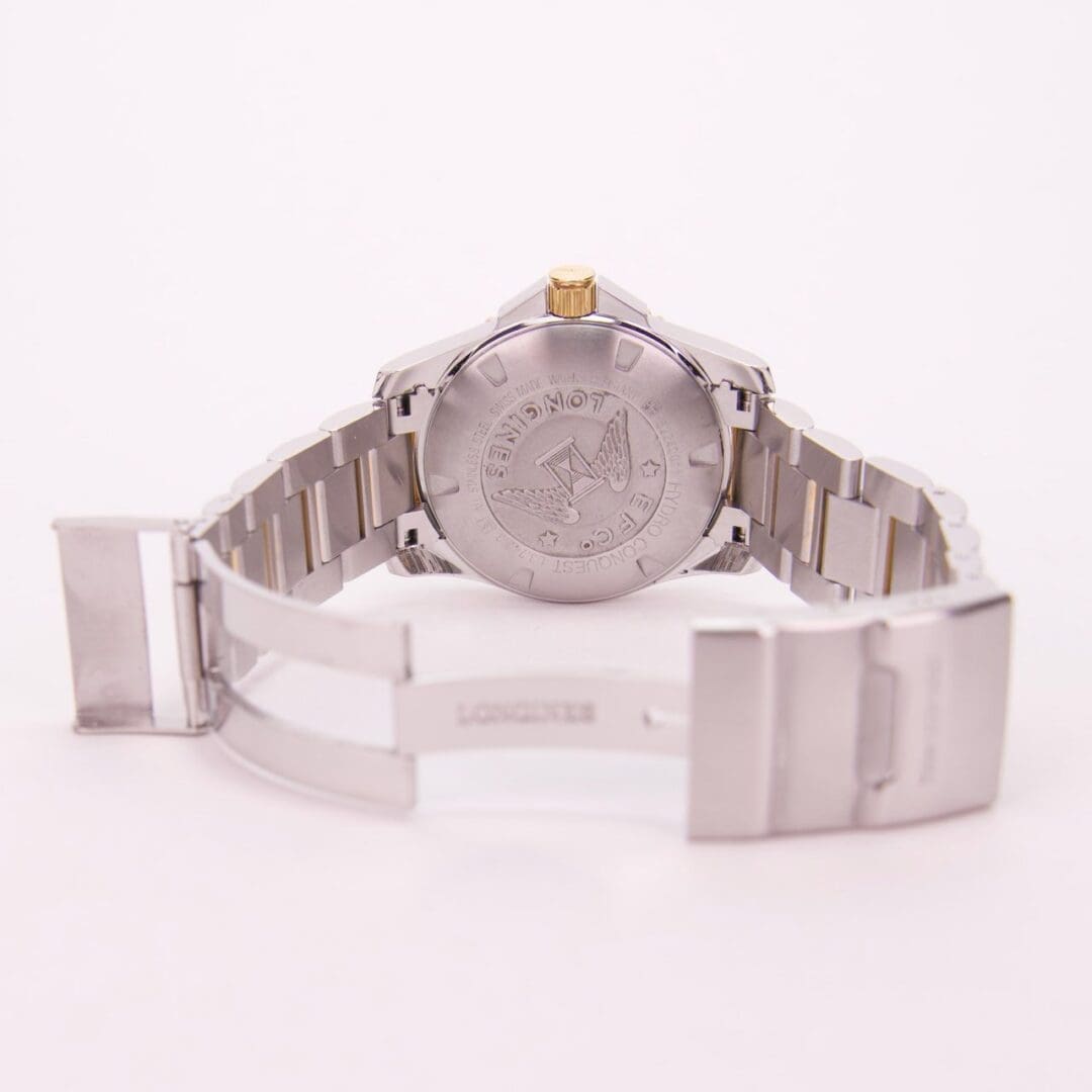 Back view of a silver wristwatch.