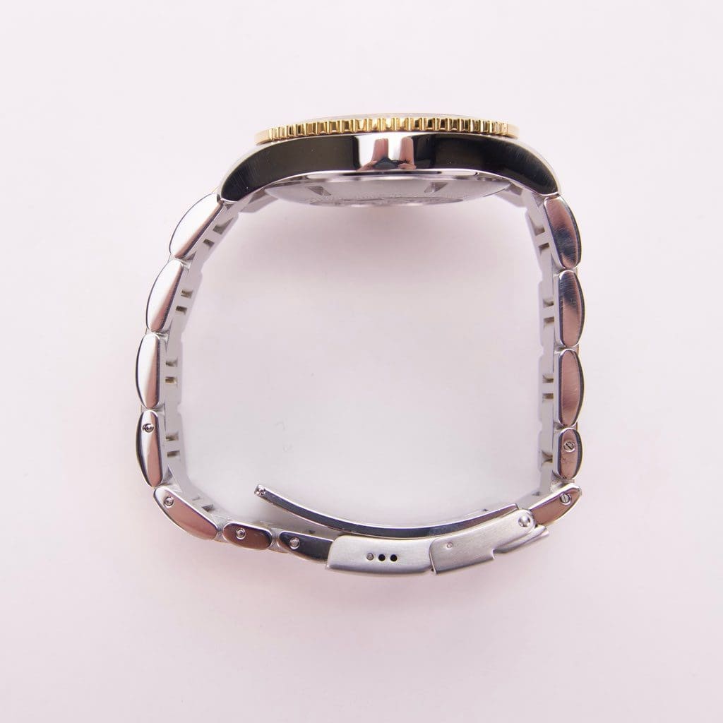 Side view of a silver wristwatch.