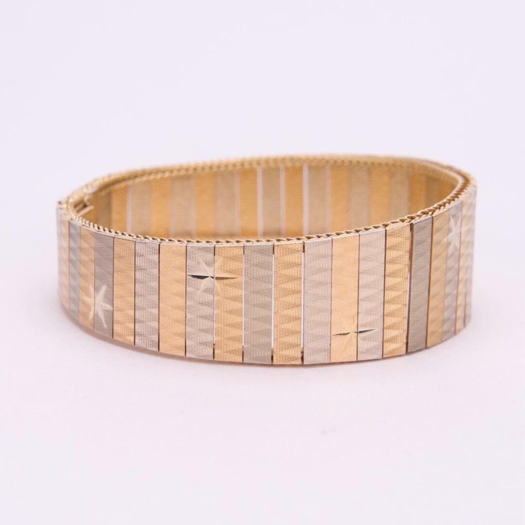 Gold and silver striped bracelet.