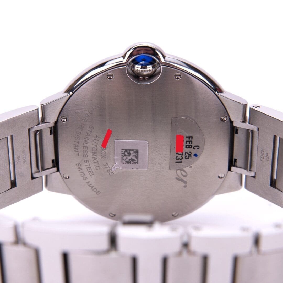Back of a stainless steel wristwatch.