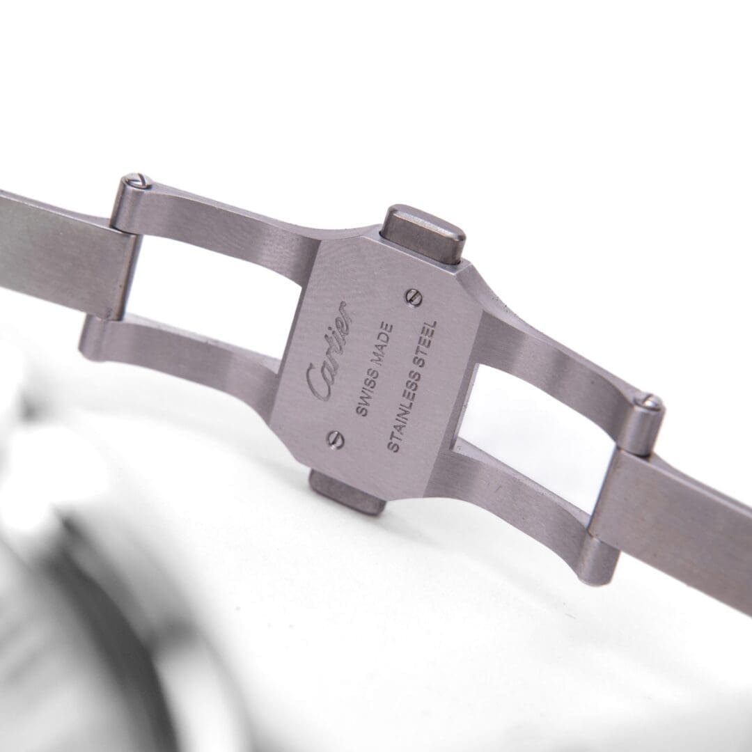 Stainless steel watch clasp with engraved text.