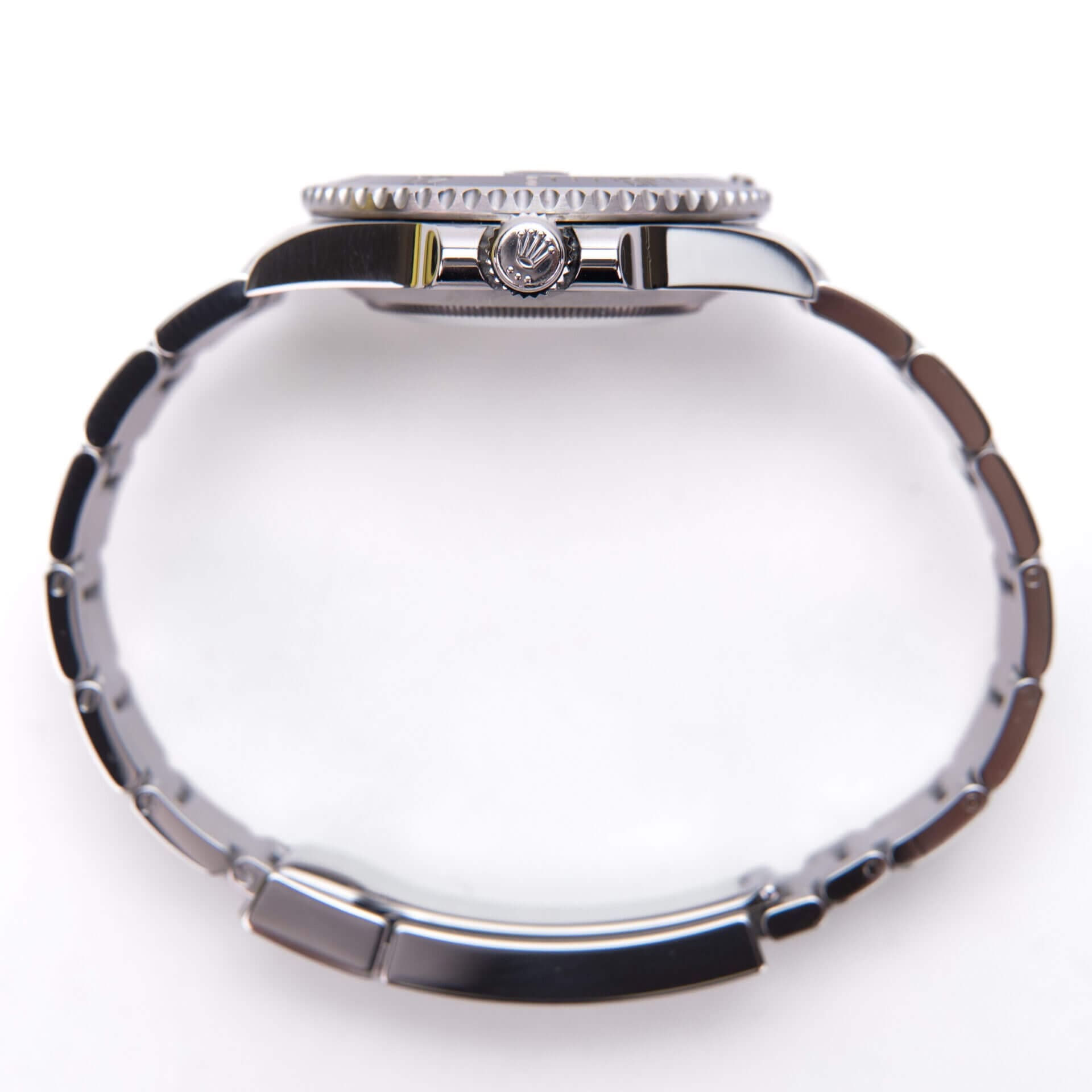 Side view of a silver wristwatch.