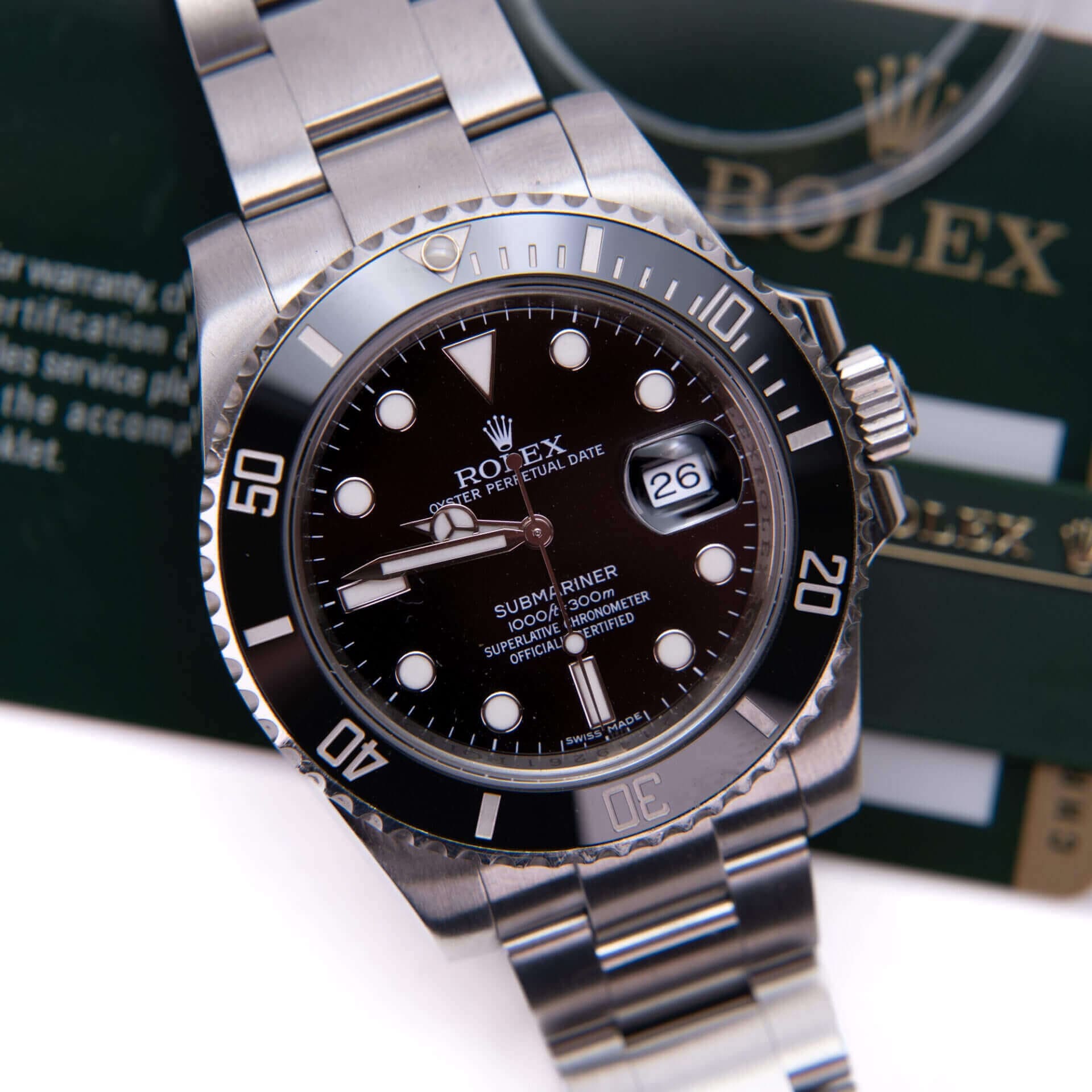 Stainless steel Rolex Submariner watch, black dial.