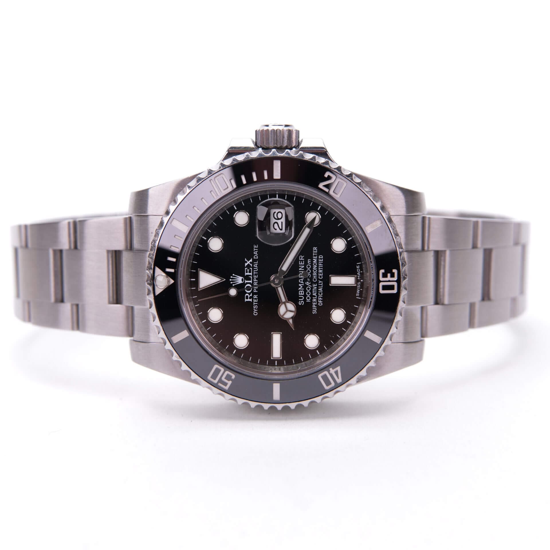 Silver luxury wristwatch with black dial.