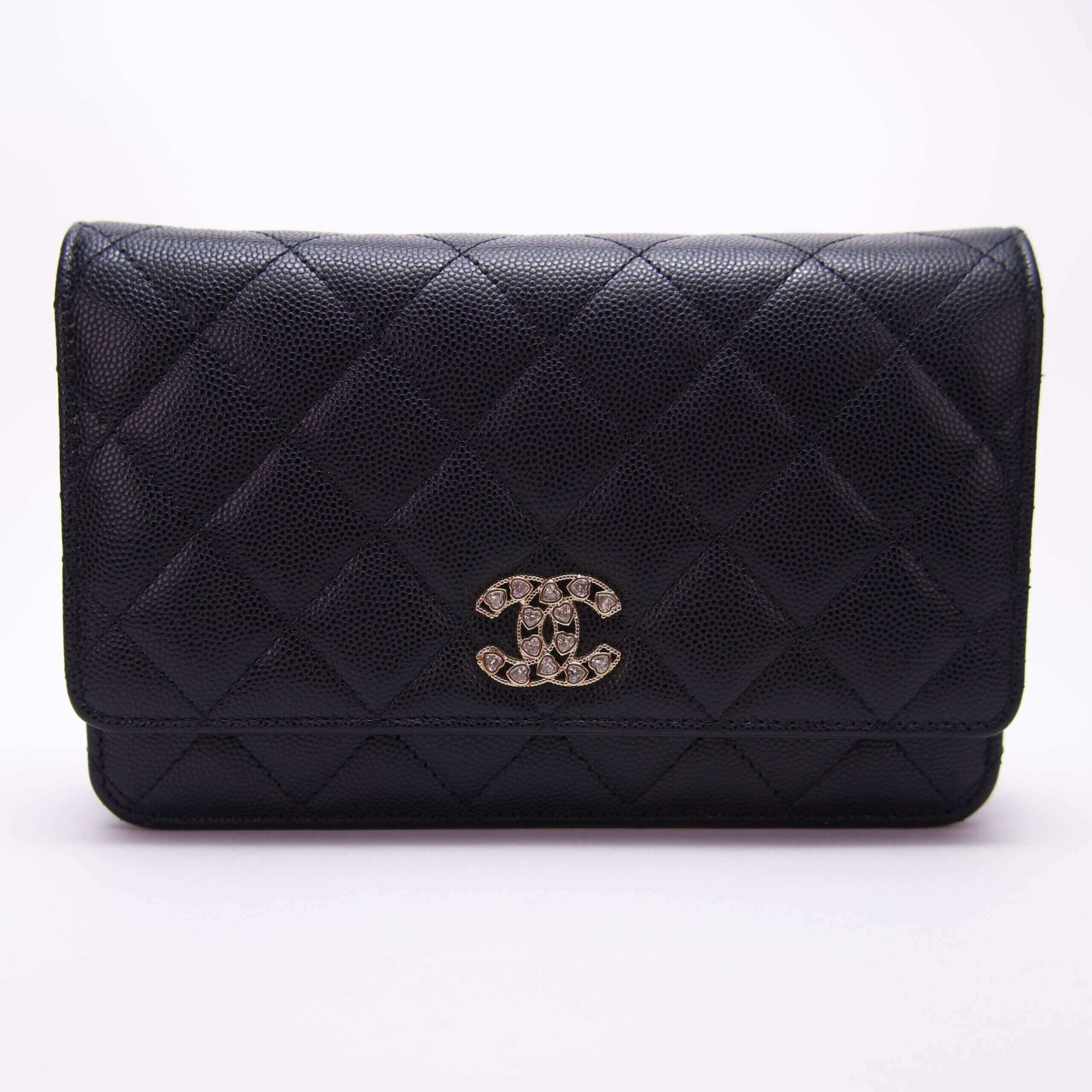 Black quilted leather clutch with logo.