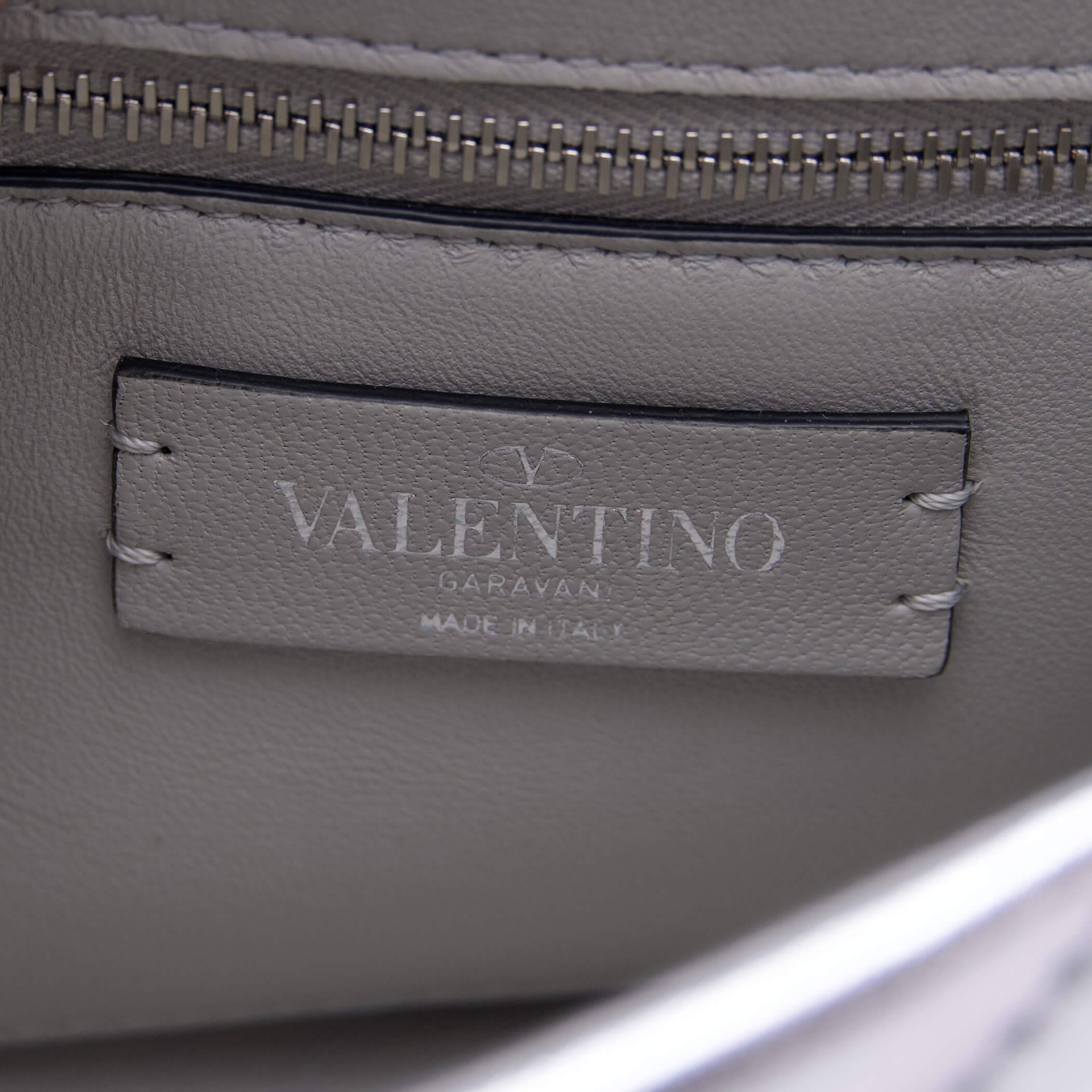 Gray Valentino leather label, close-up view.