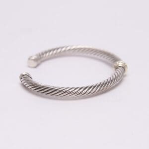 Silver twisted cable design open cuff bracelet.