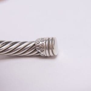 Silver cable bracelet with engraved end.