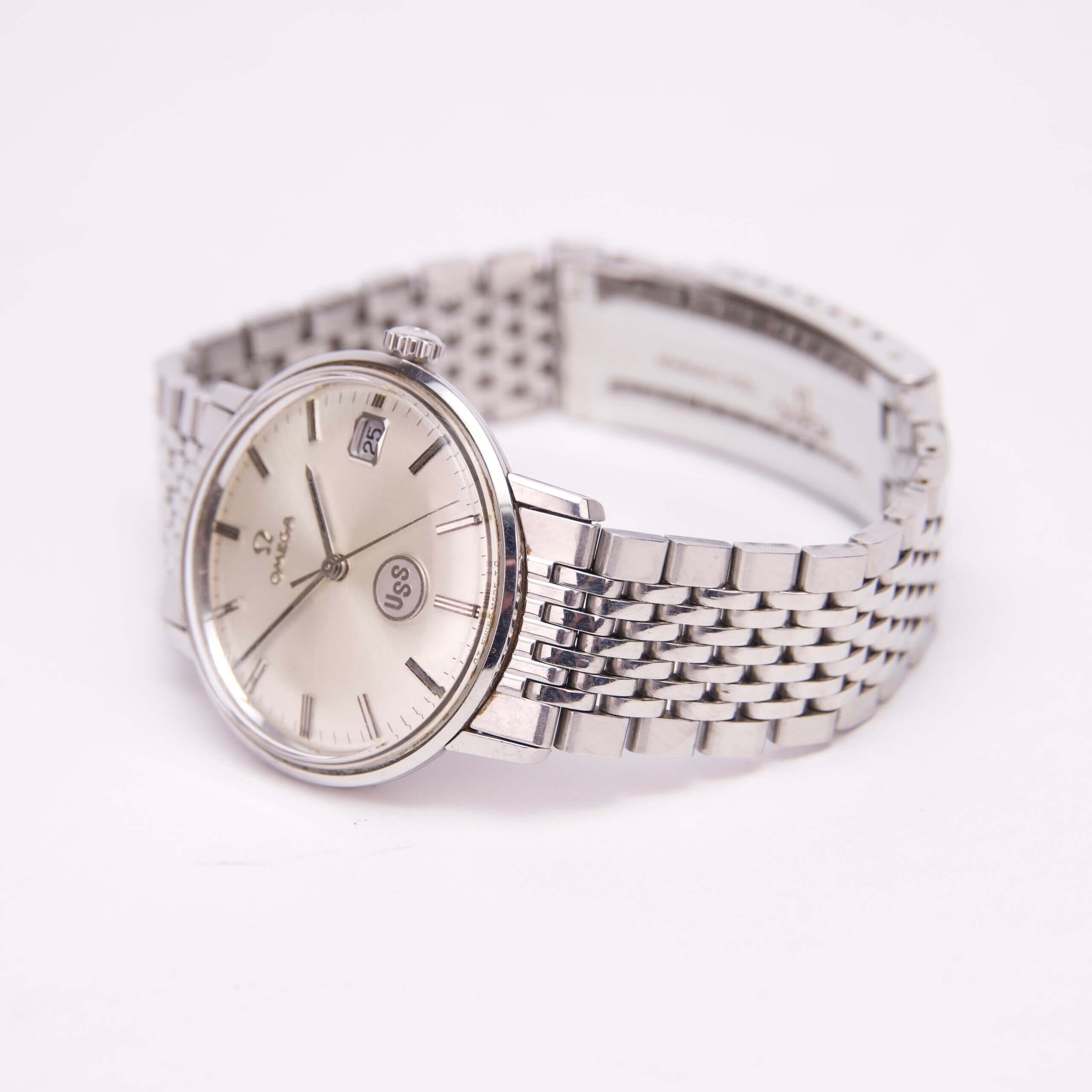 Silver wristwatch with metal link bracelet.