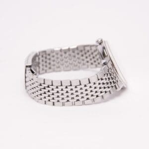 Silver watch with metal link bracelet.