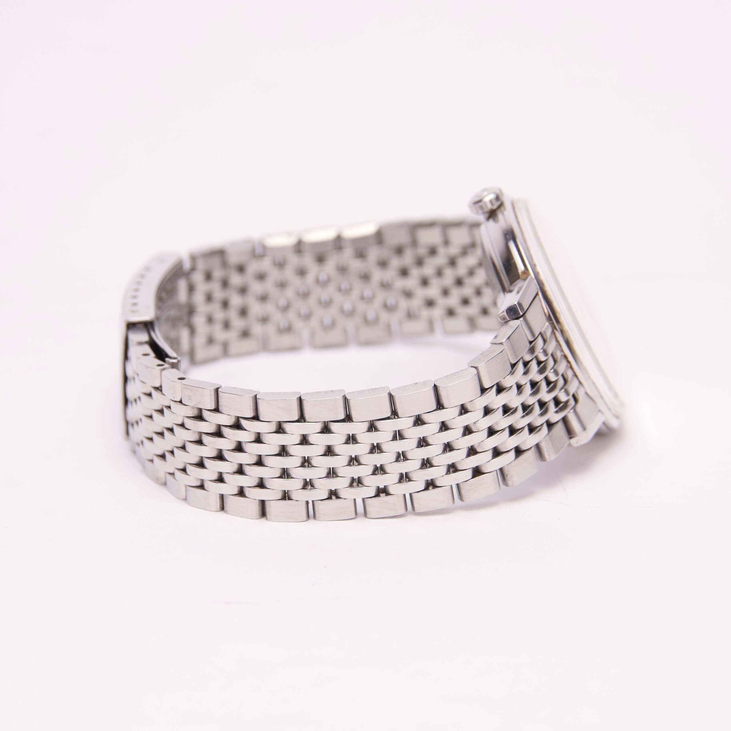 Silver watch with metal link bracelet.