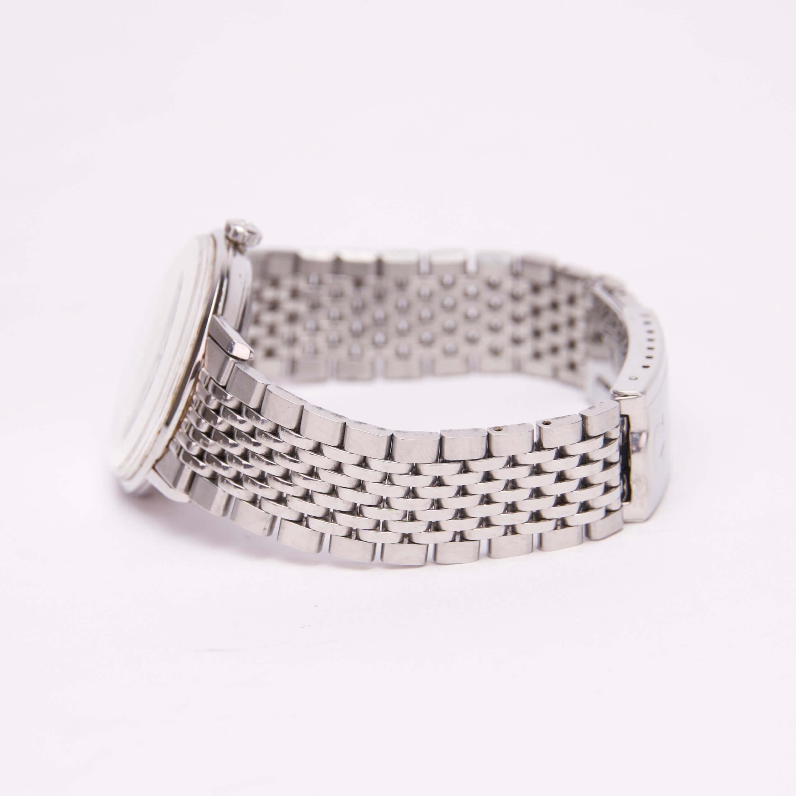 Silver wristwatch with metal link band.