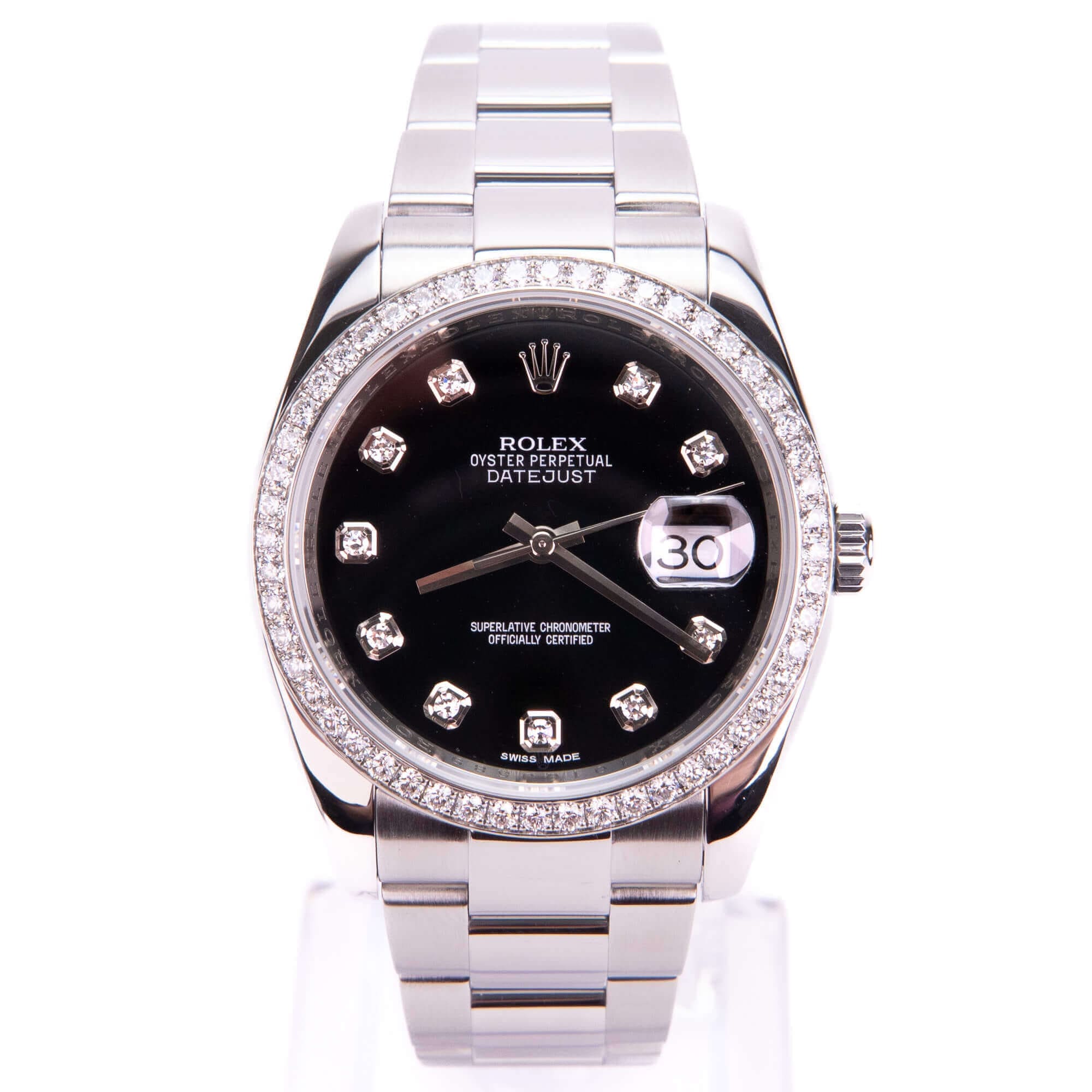 Silver watch with black diamond-studded dial.