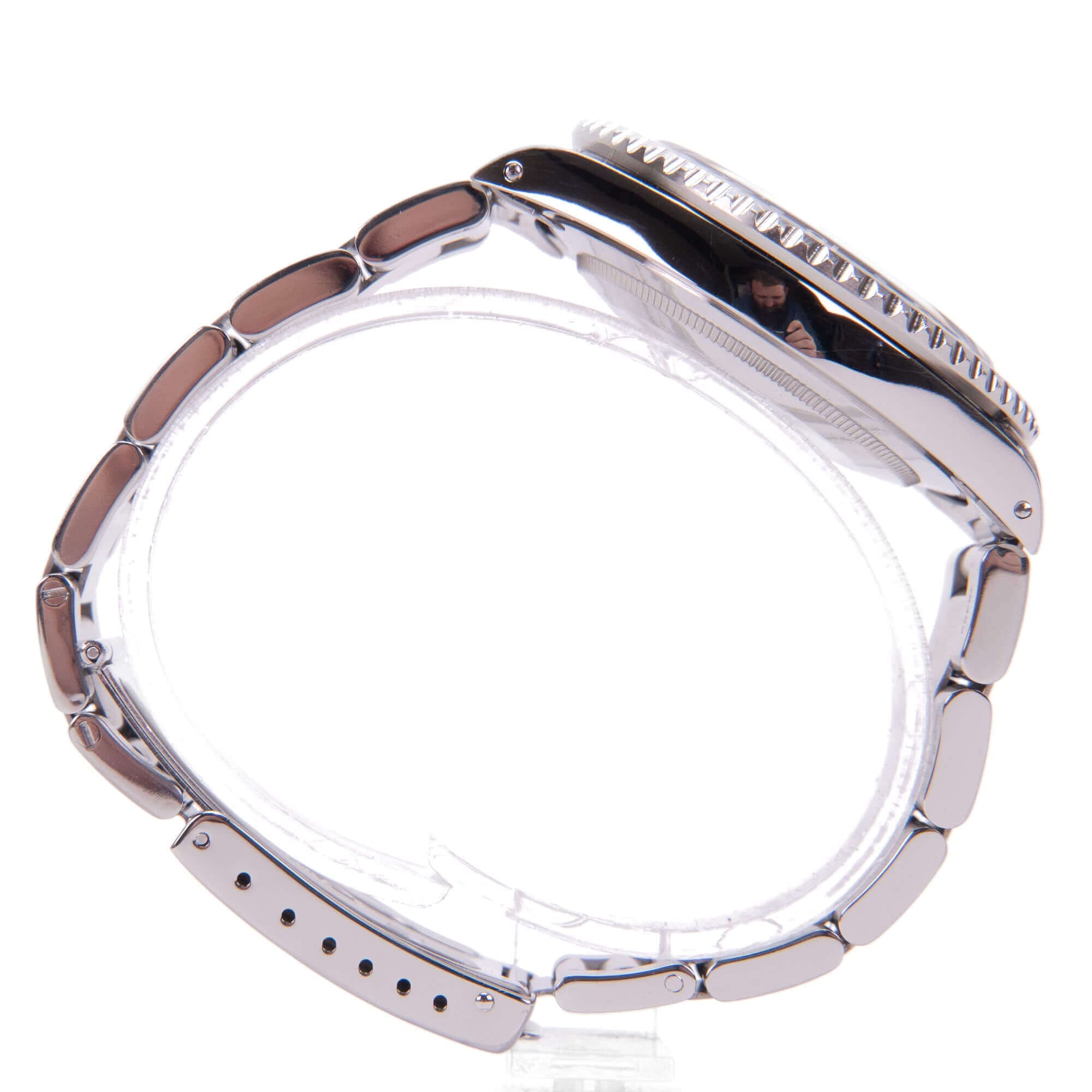 Silver wristwatch with metal bracelet, side view.