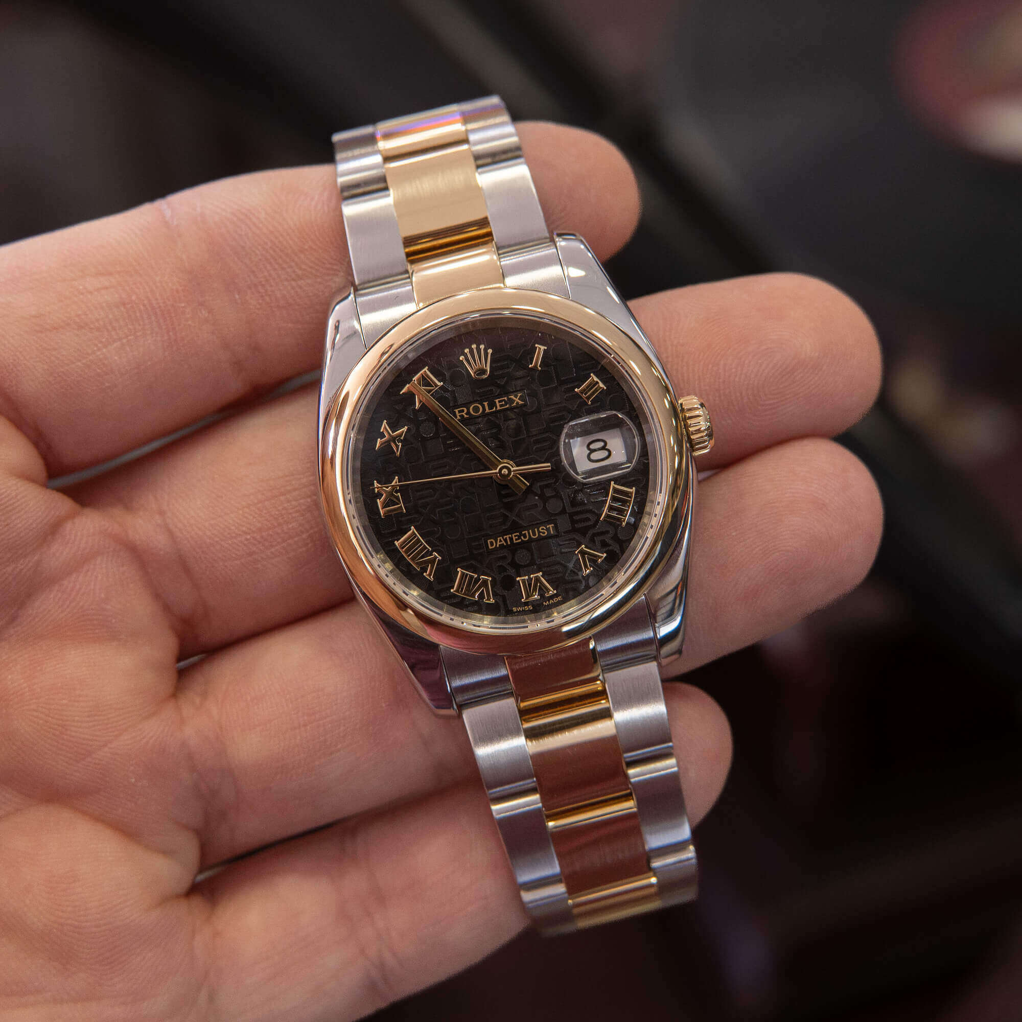 Luxury wristwatch with gold and silver accents.