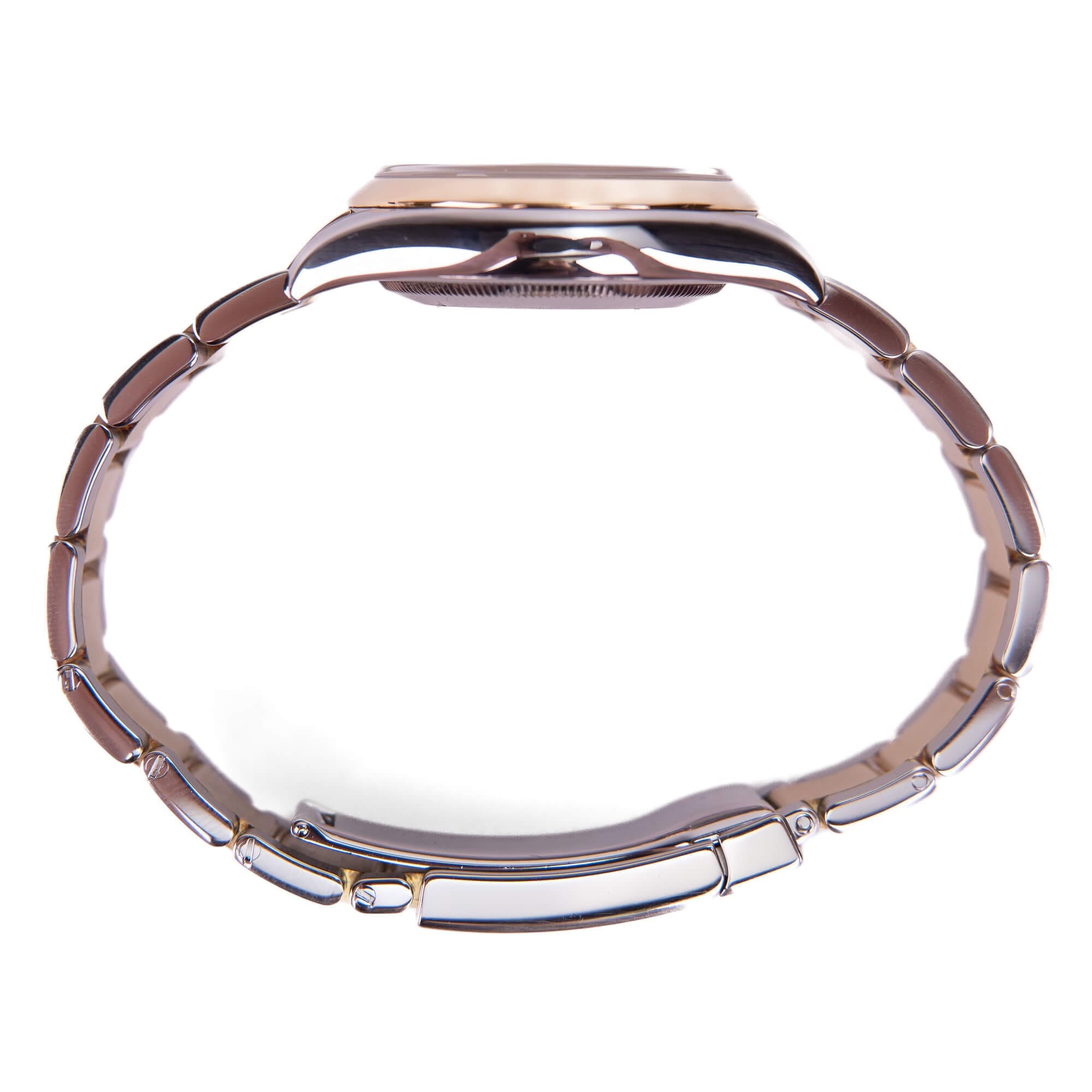 Thin wristwatch with metal bracelet side view.