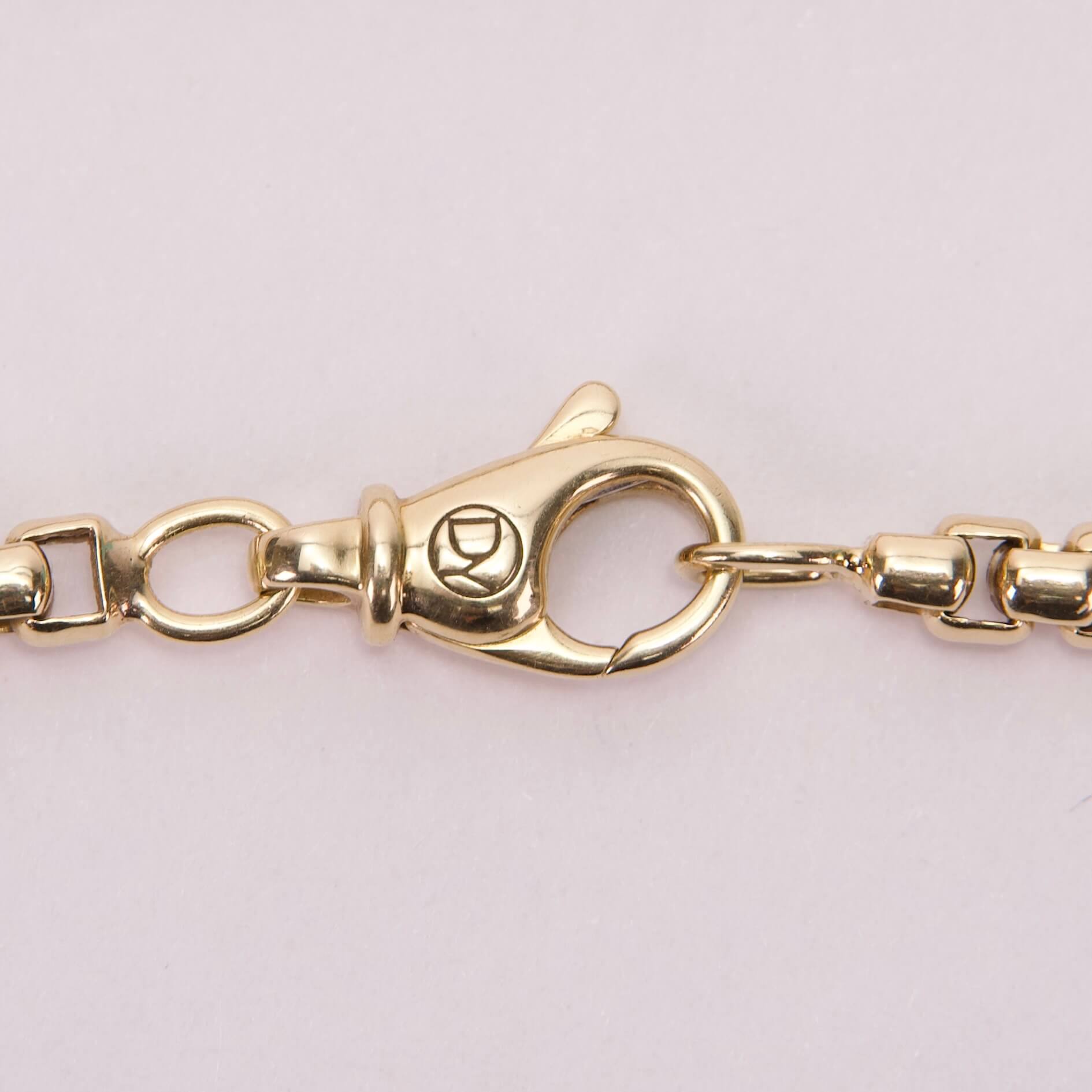 Gold lobster clasp on chain necklace.