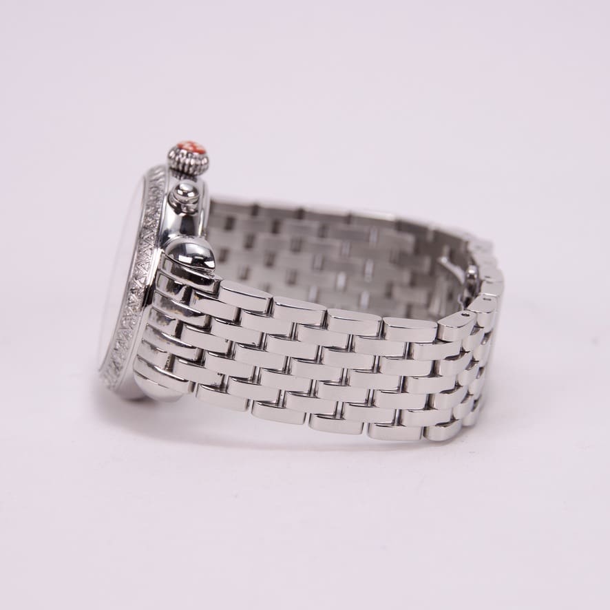 Silver wristwatch with metal bracelet side view.