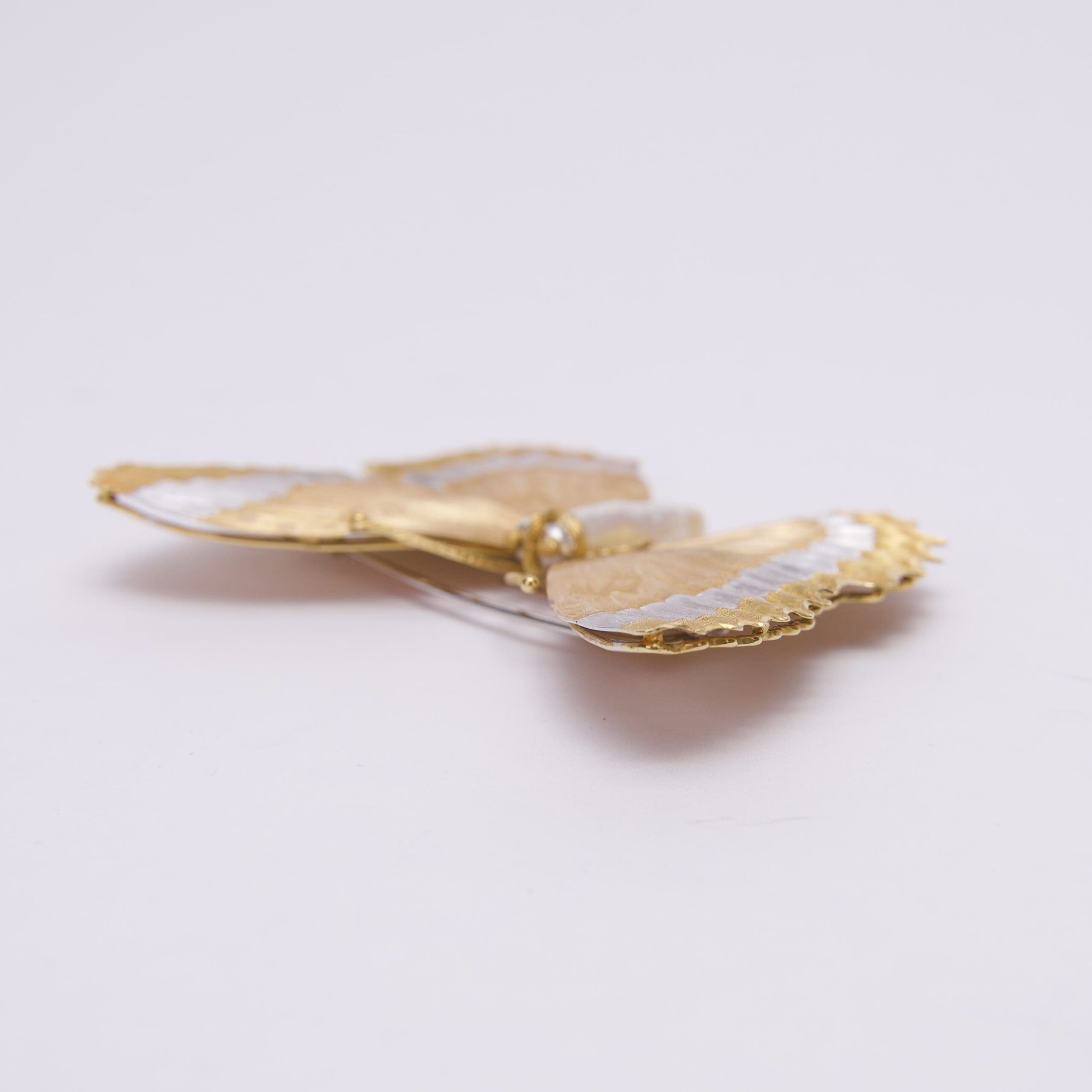 Gold and silver decorative butterfly ornament.