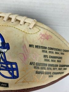 Signed football with championship inscriptions.