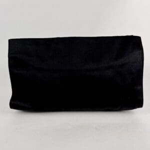 Black rectangular velvet clutch bag.