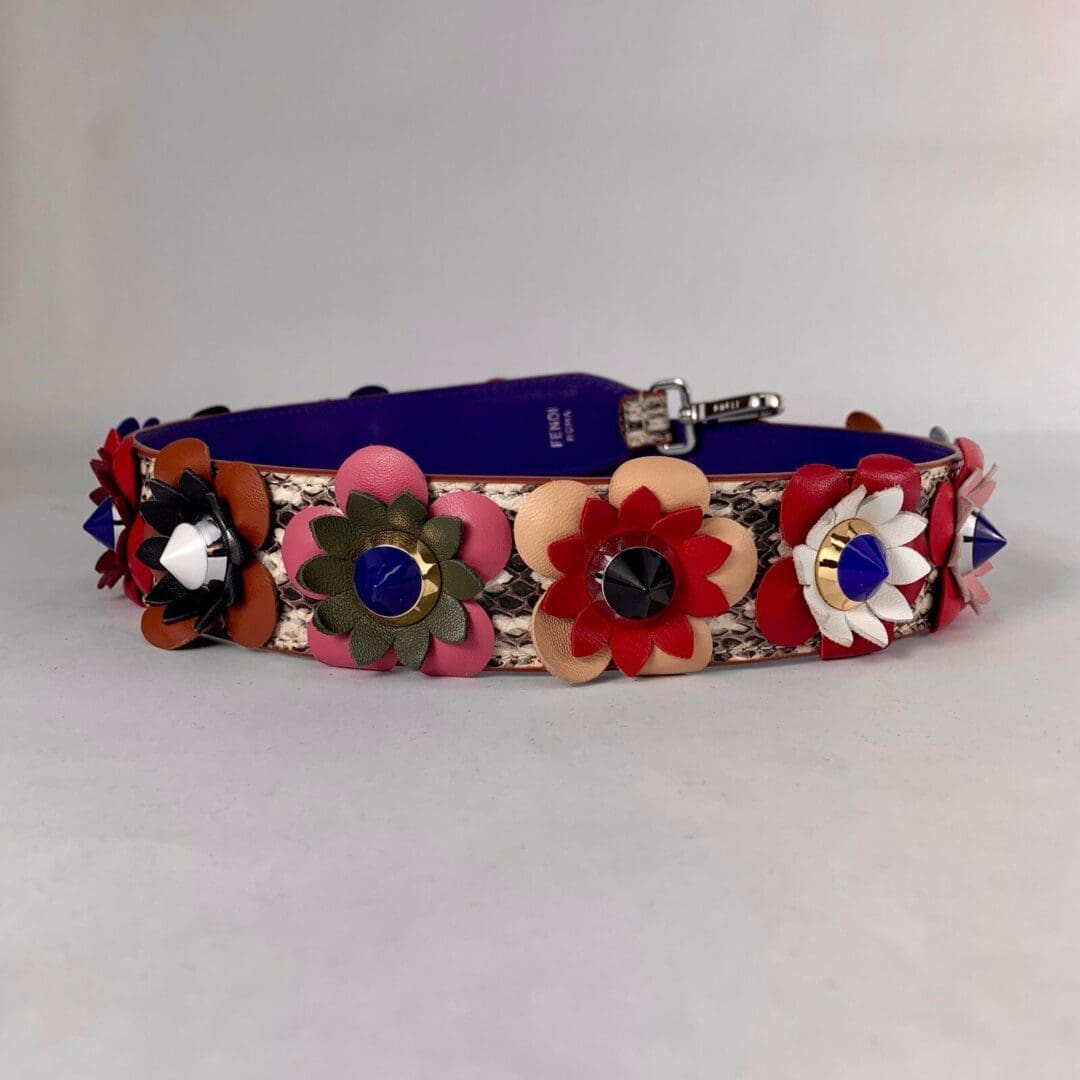 Floral leather dog collar with colorful flowers.