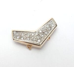 Gold and silver V-shaped rhinestone clip.