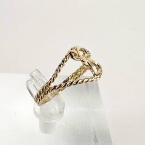 Gold twisted ring with bow design.